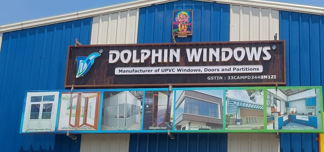 Dolphin Windows factory and showroom signboard in Coimbatore: manufacturer of uPVC windows, doors and partitions