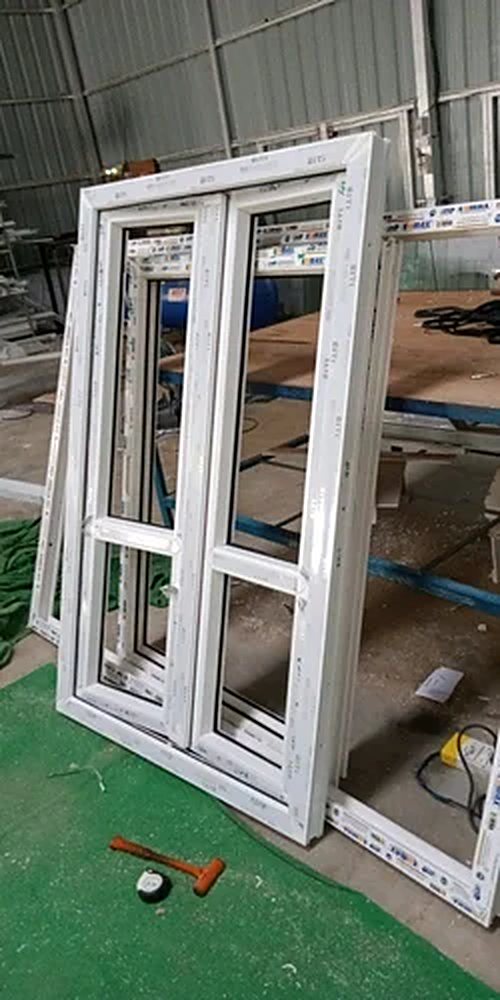 uPVC double casement window with mid rails, Dolphin Windows workshop