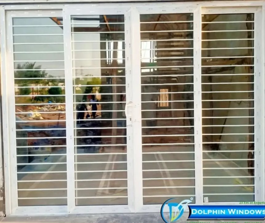 Four-panel uPVC glass door with inbuilt grill by Dolphin Windows