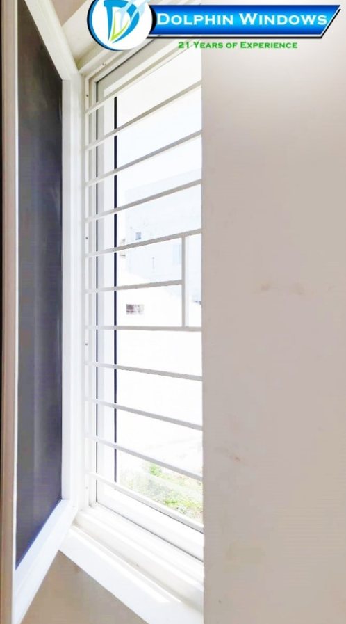 uPVC window with inbuilt grill and mosquito mesh shutter by Dolphin Windows
