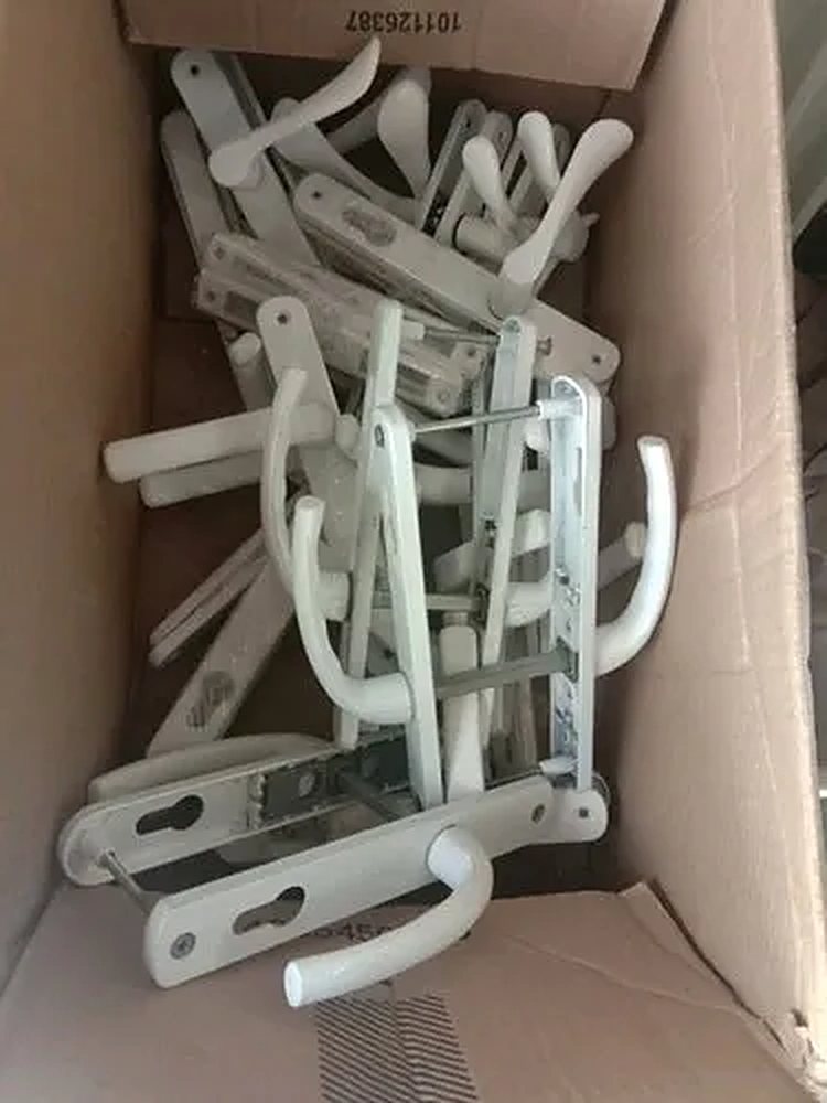 White uPVC door lever handles and lock sets supplied by Dolphin Windows